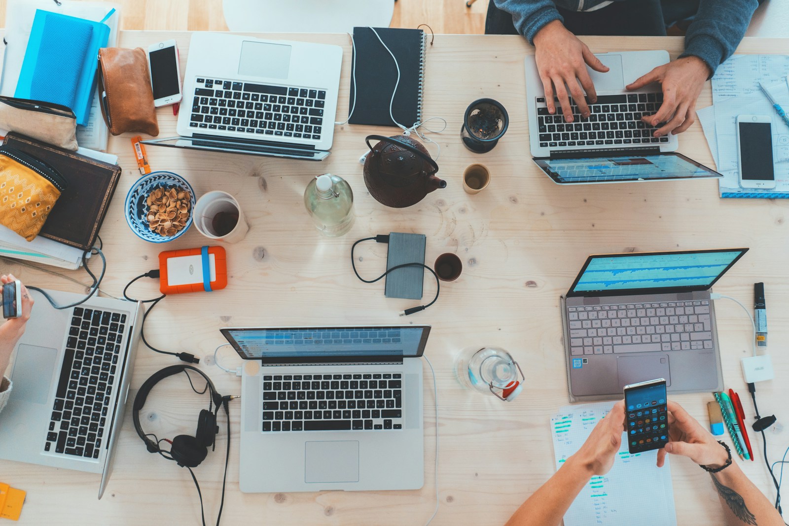 A team collaborating around computers in a modern workspace